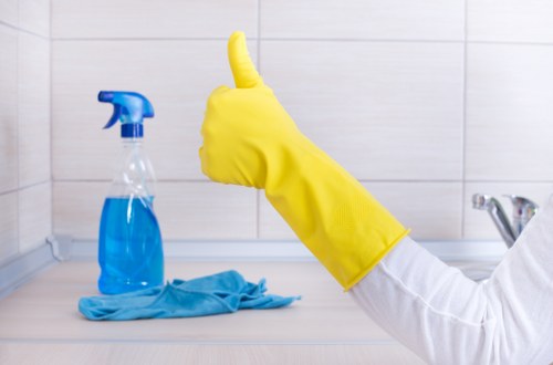 Office cleaning team sanitising desks and shared areas in Shoreditch